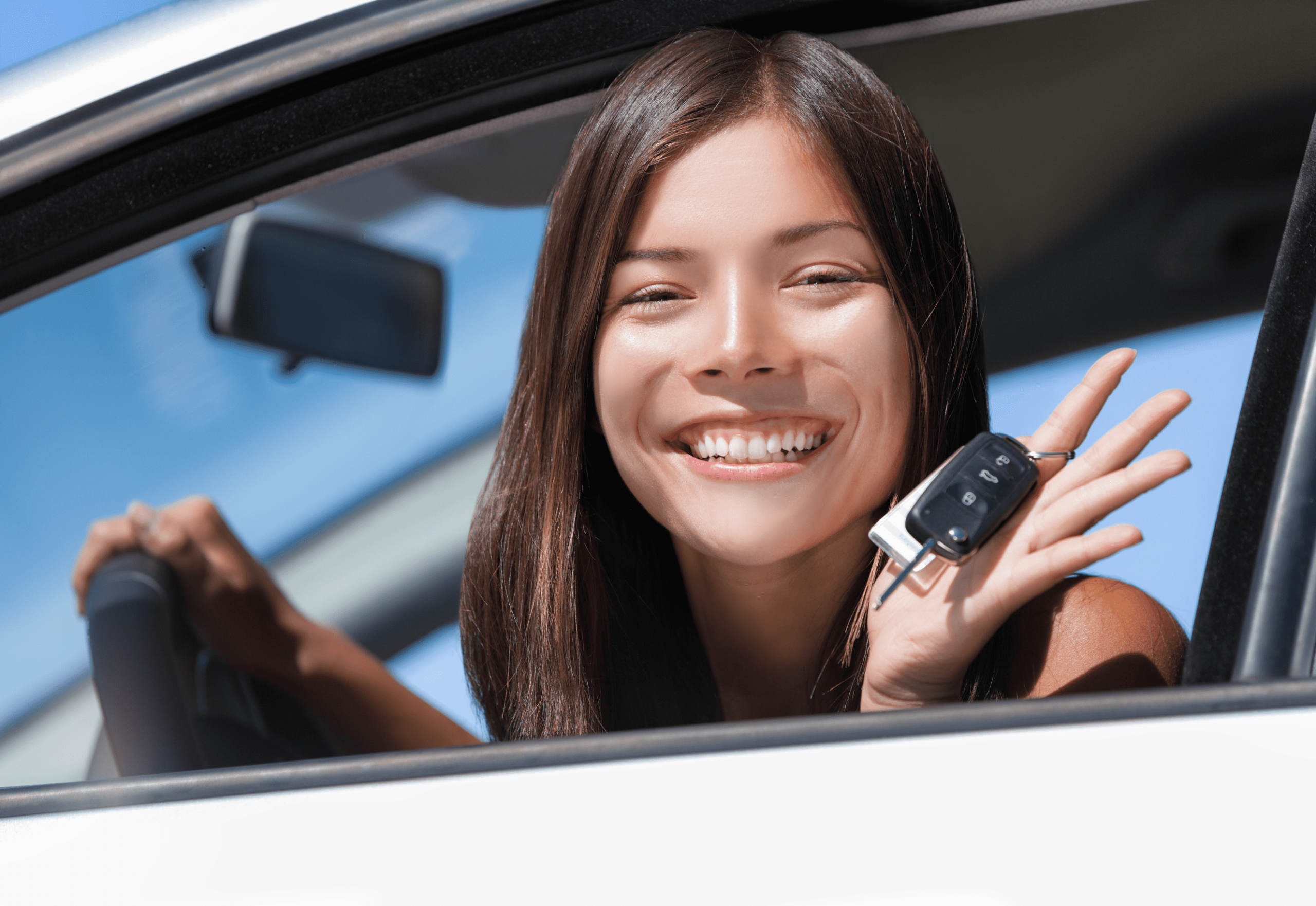 Proud woman showing car keys after securing vehicle finance in NZ