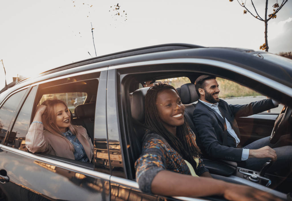 People in a car after being accepted for finance in New Zealand.