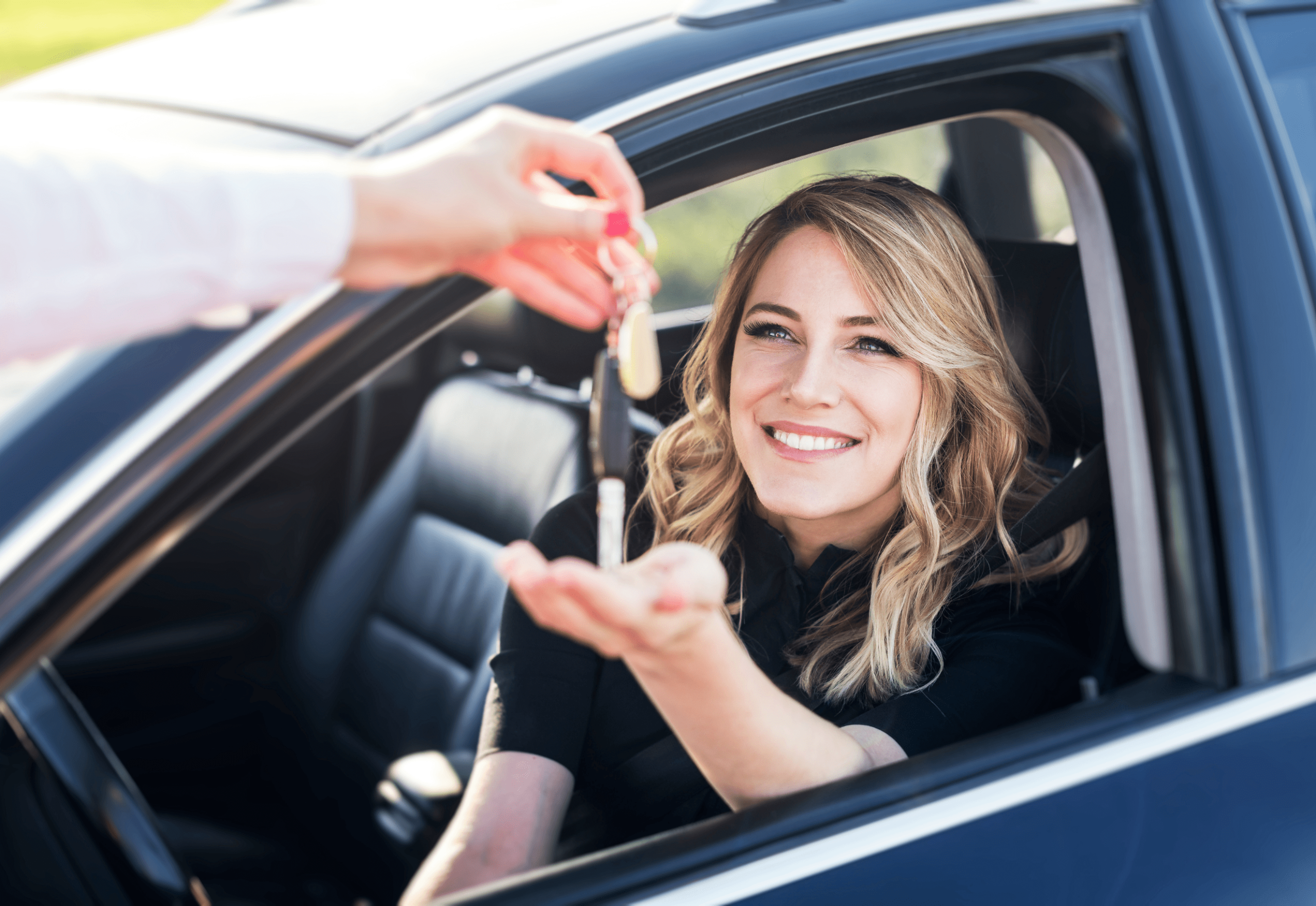 Woman receiving car keys after getting personal finance approved through Limitless Finance NZ