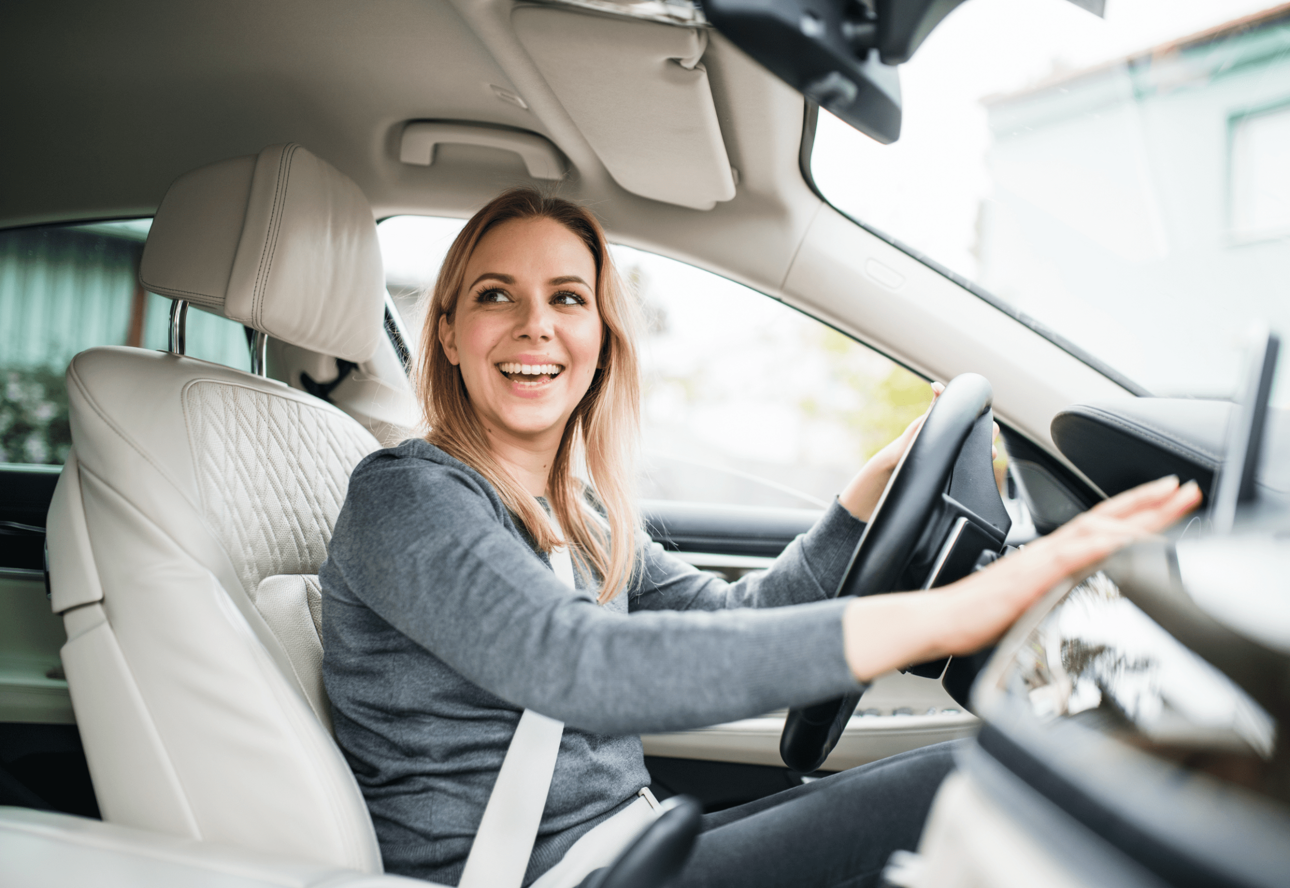 Woman test driving a car before getting approved for vehicle finance in NZ